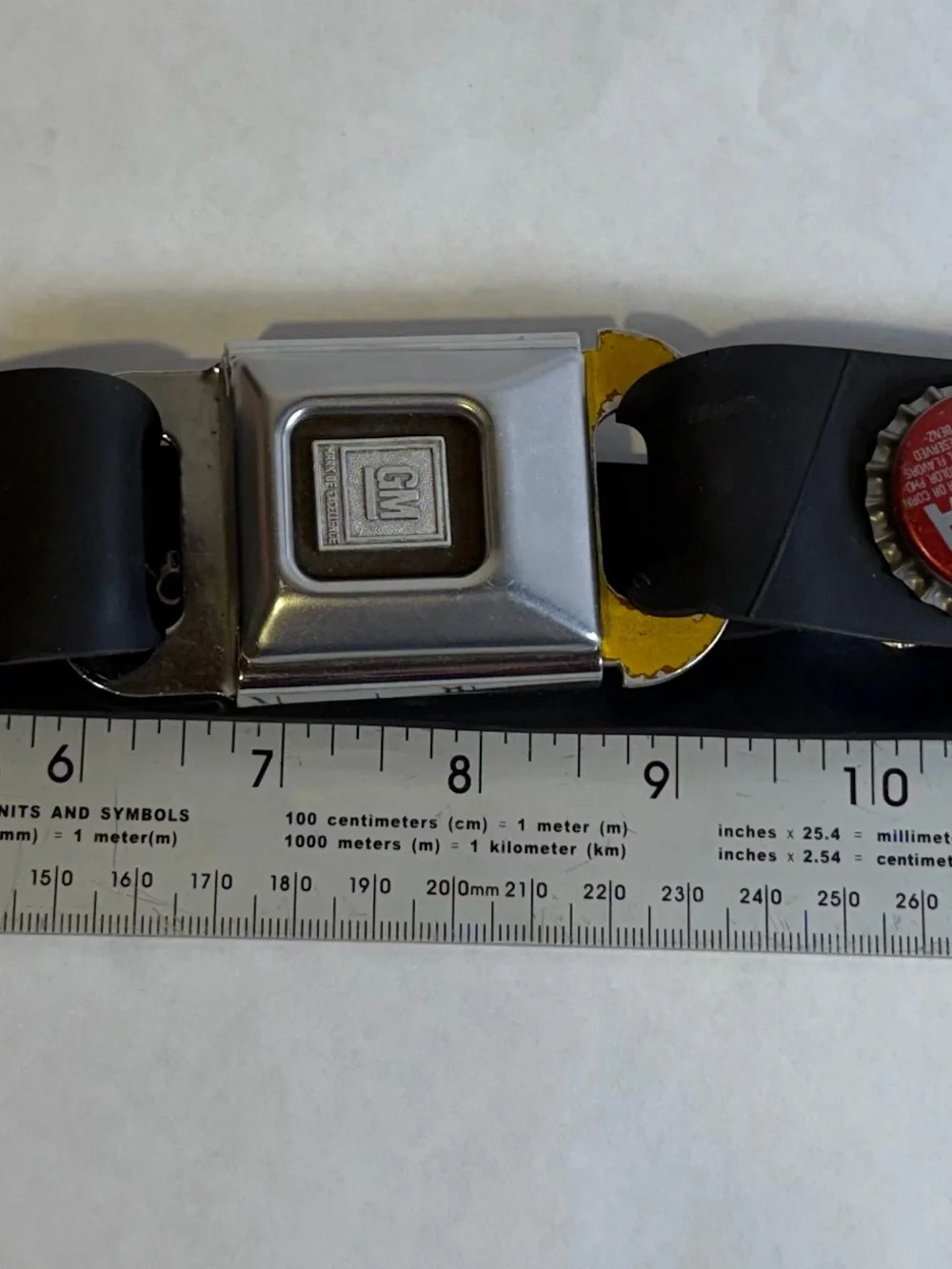Vintage GM Seat Belt Bottle Cap Belt Mark of Excellence Chevrolet Hot Rod
